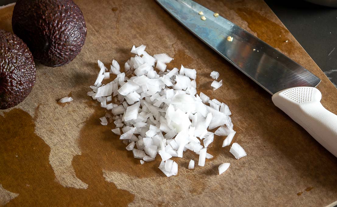 Mincing and smooshing onion for the Guacamole