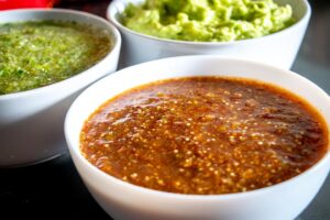 Need some munchers for a crew? Here's the tastiest way to make your own Salsa and Guacamole for 10-20 people.