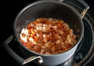 Adding some onion to the pan for the Charro Beans