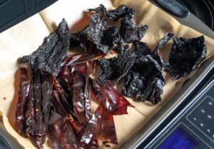 Roasting dried chile pieces