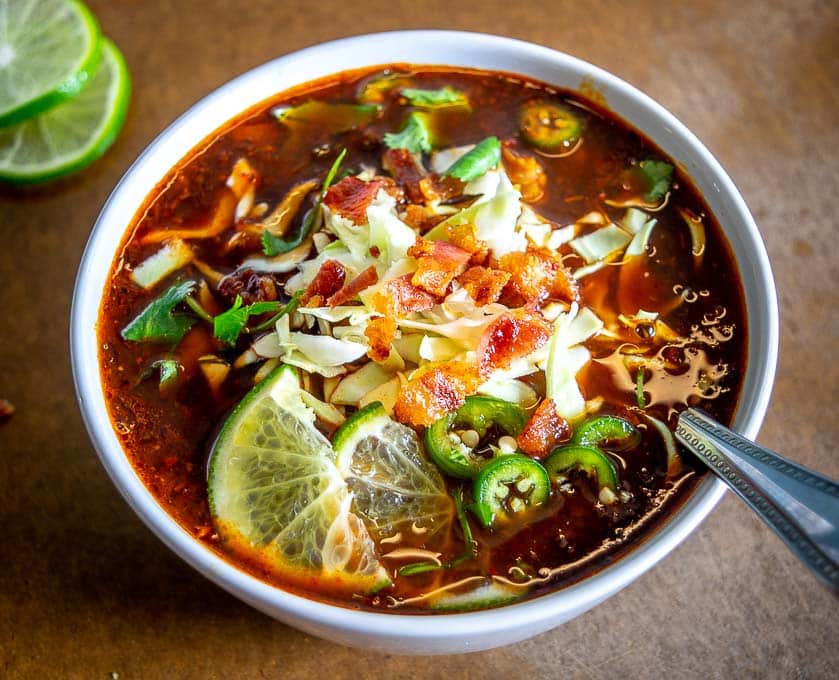 Here's an easy recipe for lip-smacking batch of Bacon Red Pozole! Be sure to garnish with a final burst of acidity as this will really bring it to life.