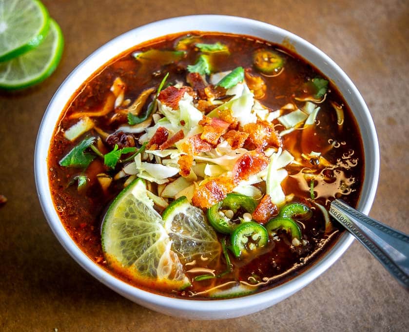 Here's an easy recipe for lip-smacking batch of Bacon Red Pozole! Be sure to garnish with a final burst of acidity as this will really bring it to life. 