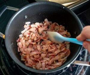 Cooking the bacon in a medium sized saucepan