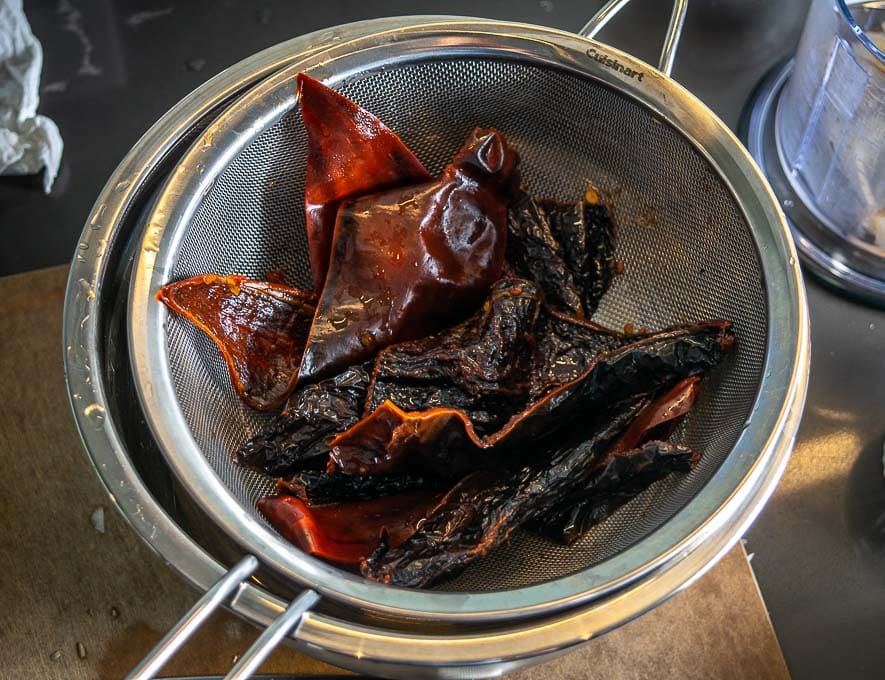 Draining the Ancho and Guajillo chiles for the Pozole