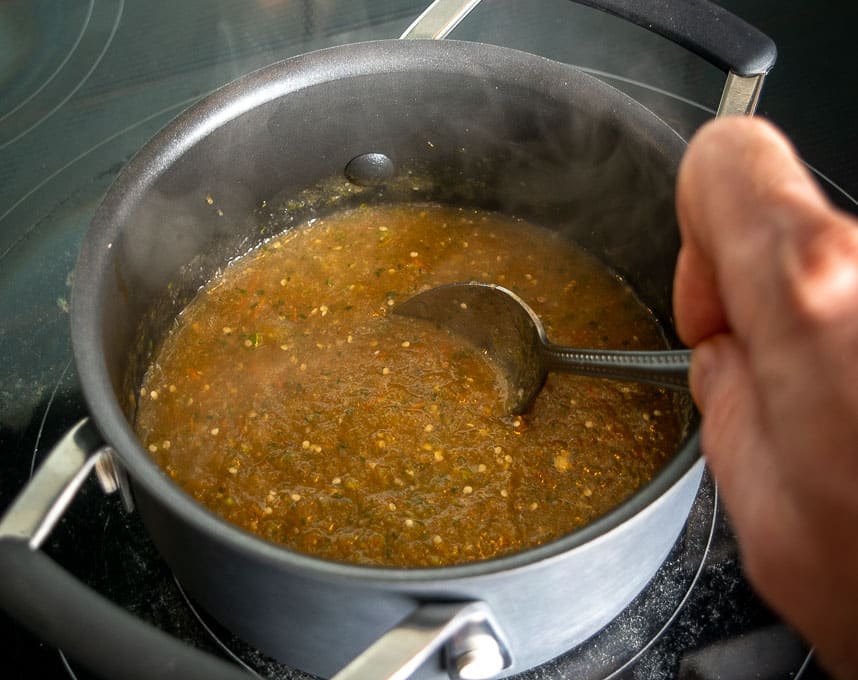 Simmering the salsa in some leftover bacon drippings