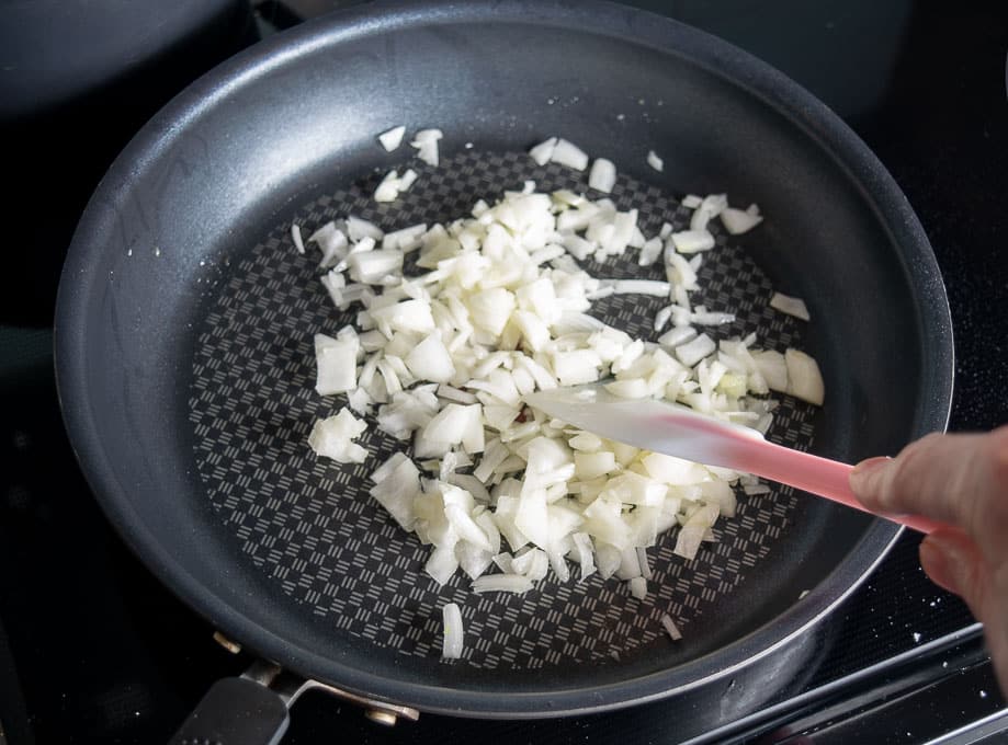 Cooking half onion in a glug of oil for the chipotle ground beef