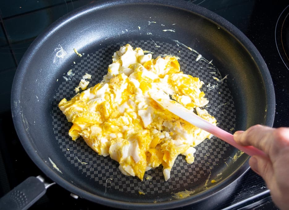 Cooking 6 eggs in some butter over medium low heat