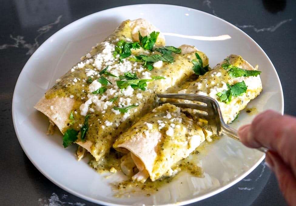 Here's an easy way to make a delicious batch of Creamy Poblano Enchiladas. The sauce is loaded with that sweet roasted Poblano flavor --  so good!