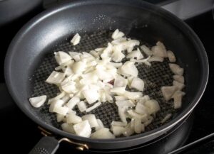 Cooking 1/2 onion in two tablespoons of butter for the creamy poblano sauce