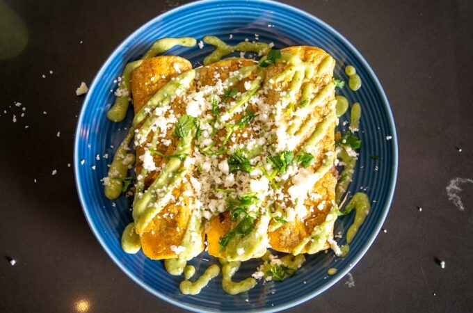 Fridge Enchiladas are a great way to make quick, satisfying meals using leftovers. I drenched this batch in Salsa de Aguacate and they were delicious!