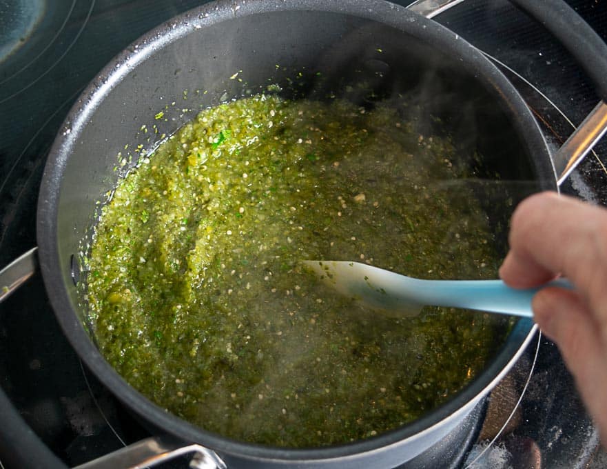 Cooking the green sauce in a glug of oil