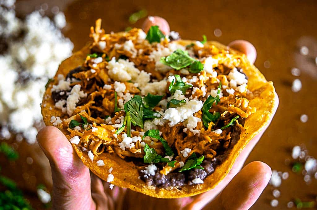 Closeup of a creamy chipotle chicken tostada