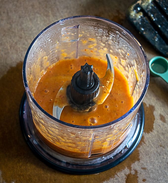 Combining chipotle sauce in a blender