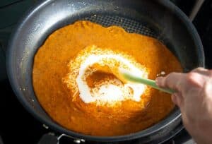 Adding cream to the chipotle sauce