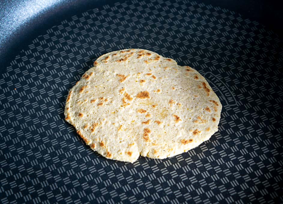 Light brown spots forming on the underside of the tortilla