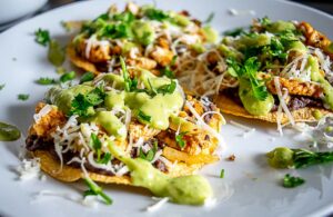 Final plate full of Chicken Tostadas with Salsa de Aguacate