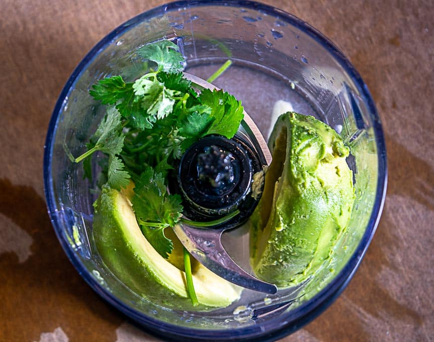 Gathering ingredients for salsa de aguacate in blender