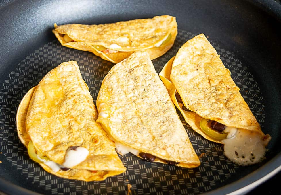 Crisping up the tortillas in a bit of oil