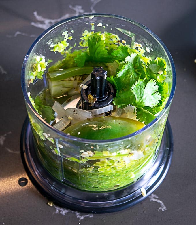 Adding cilantro and juice of 1/2 lime to the blender