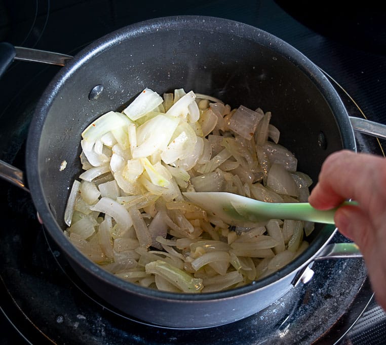 Cooking the onion in the leftover bacon drippings