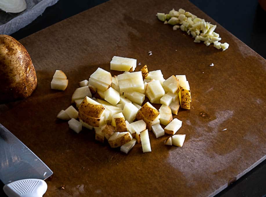 Dicing up half of a russett potato for the jalapeno soup