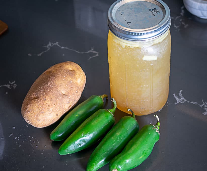 Jalapenos, stock, and a potato