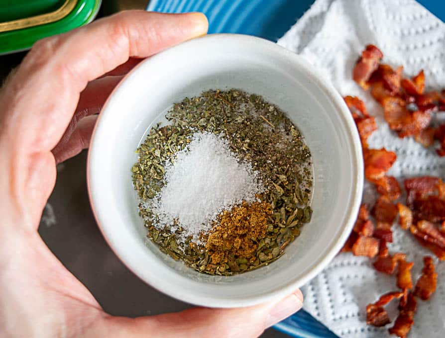 Adding the aromatics to the onion garlic mixture in the pan