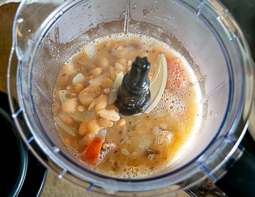 Combining Peruano bean soup in the blender