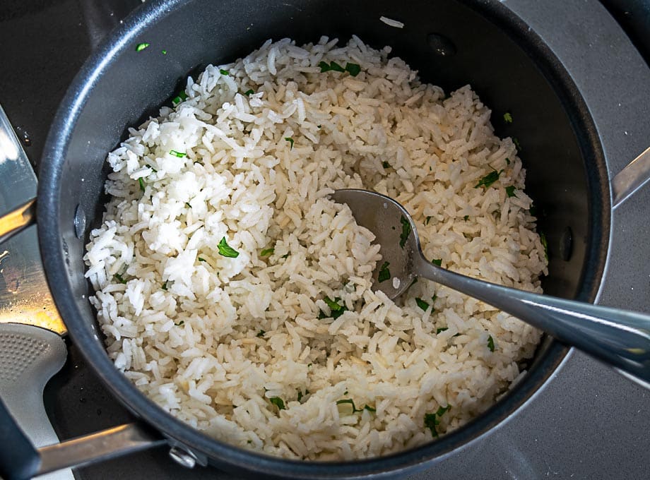 adding cilantro and lime to white rice